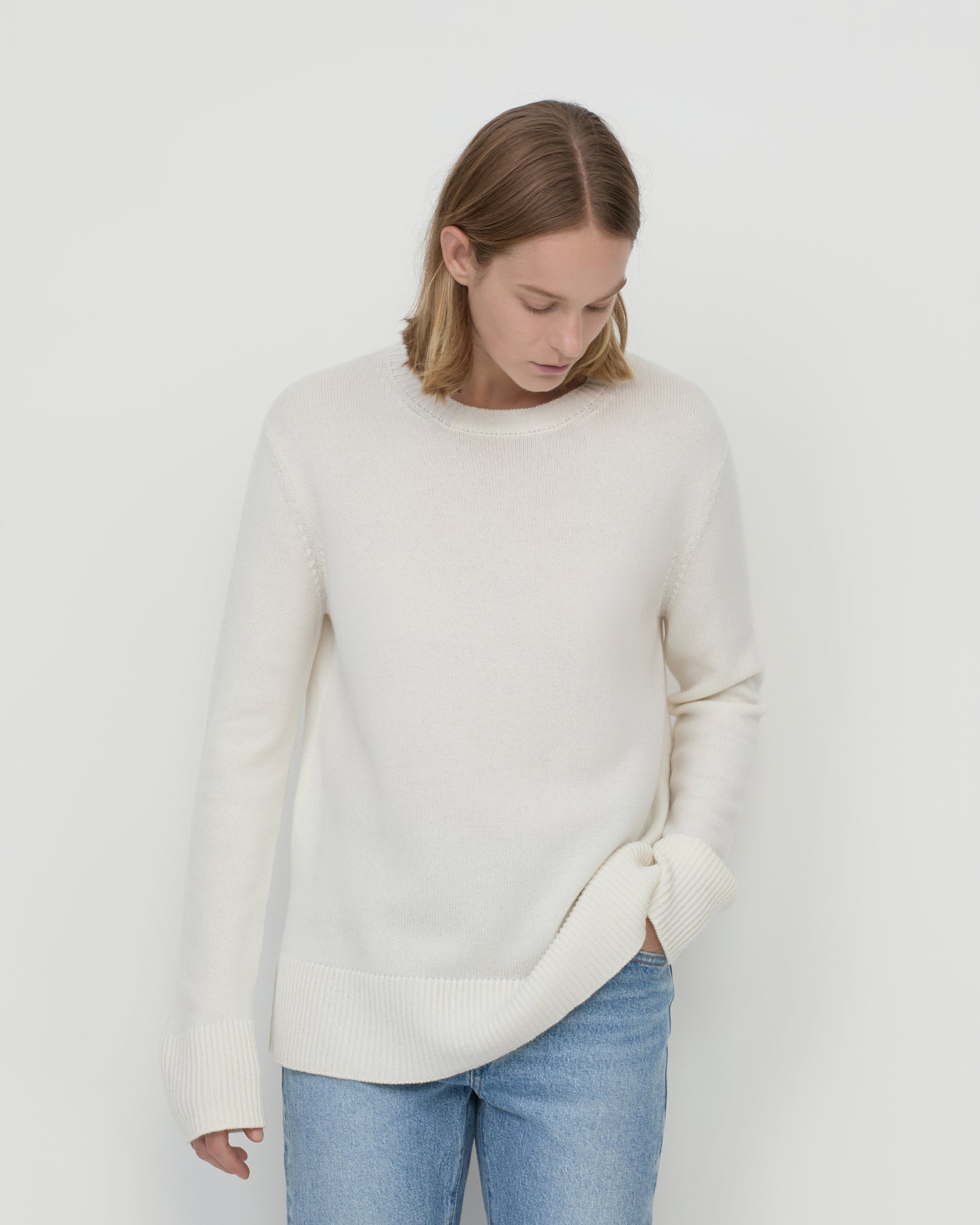 Model wears Casasola Maria knitted cashmere oversized crewneck sweater - front view