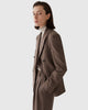 Model wearing CASASOLA 4x1 double-breasted flannel blazer with matching high-waisted trousers and knitted cashmere turtleneck, made in Italy – side view