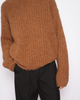 Model wears Casasola Orso Cashmere Silk Boucle Brown Crewneck Sweater with high-waisted trousers - front view