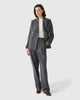Model wearing Casasola grey Italian flannel high-waisted trousers with front pleats