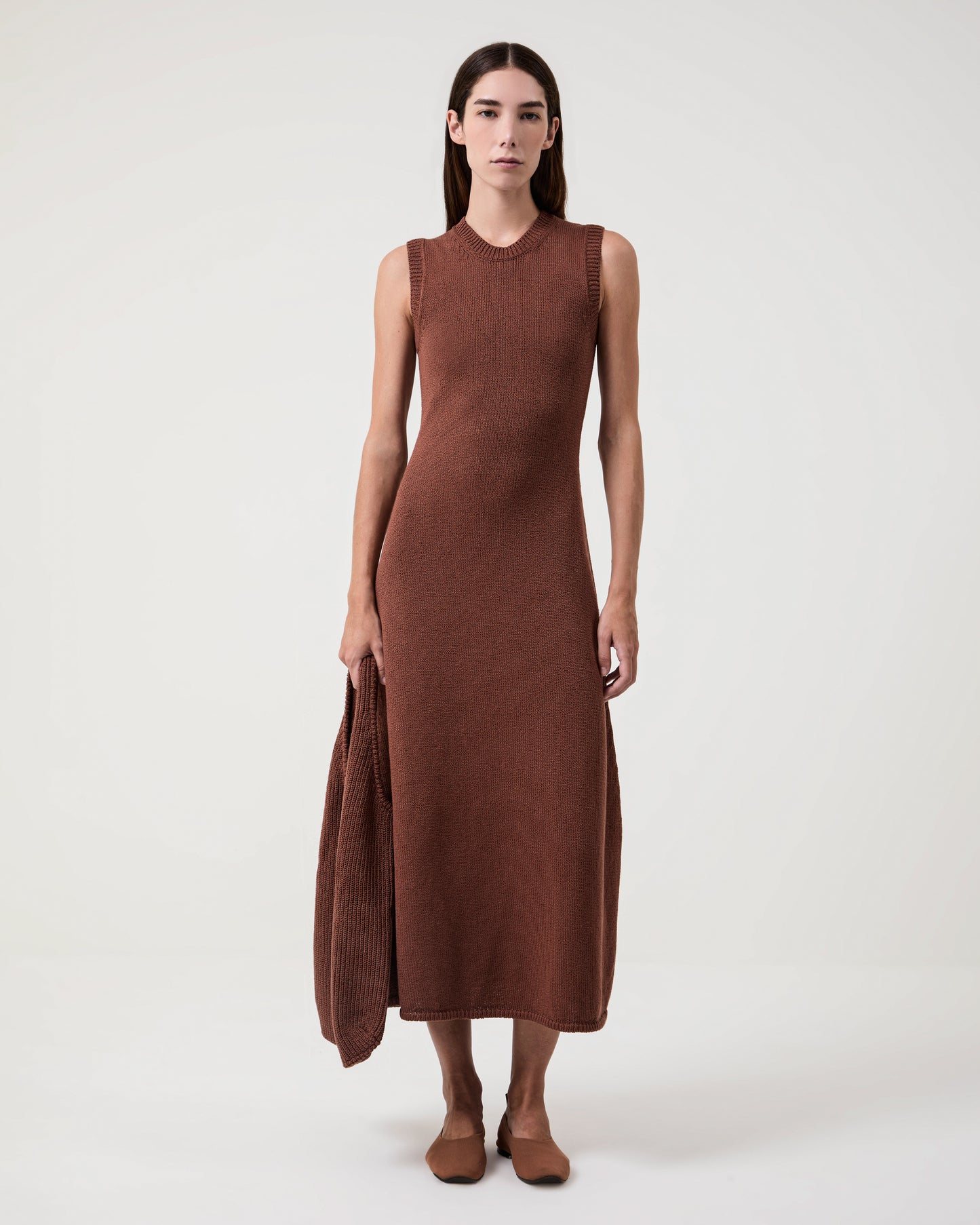 Model Wears Casasola Costanza knitted cotton shoulder brown bag with matching sleeveless midi-dress