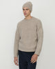 Man wearing Casasola Fedele cashmere and silk knitted boucle beanie in beige with matching crewneck sweater