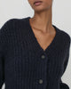 Woman wearing Casasola Fumo Knitted Cashmere Silk Boucle Cardigan in Navy - Detail View