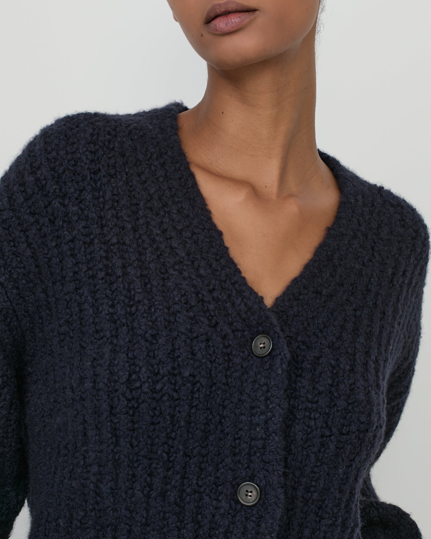 Woman wearing Casasola Fumo Knitted Cashmere Silk Boucle Cardigan in Navy - Detail View
