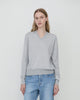 Woman wears Casasola Giada Wool V-Neck sweater in Grey - front view