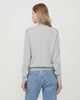 Woman wears Casasola Giada Wool V-Neck sweater in Grey - Back view