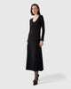 Model wears Casasola silk-wool mid-length pointelle-stitch black dress 