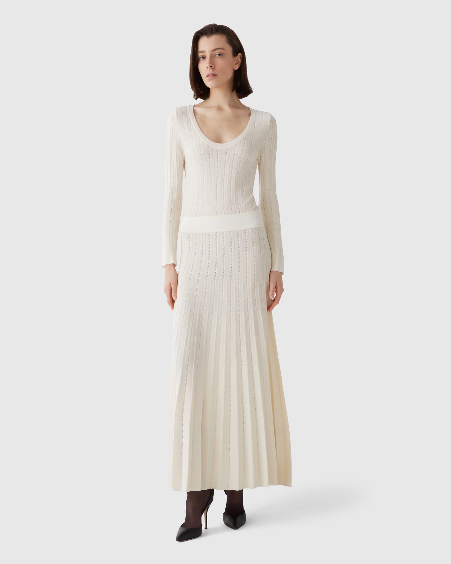 Model wears Casasola silk-wool mid-length pointelle-stitch ivory dress 1
