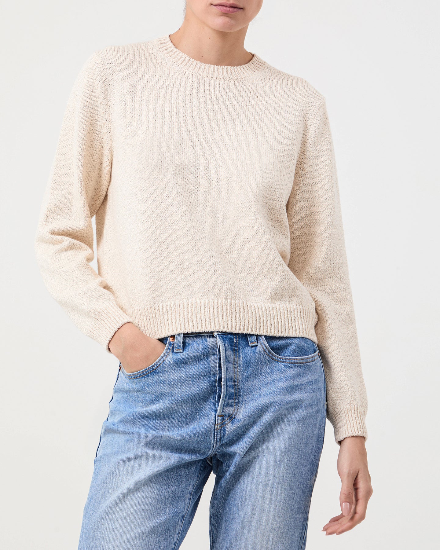 Model wears Casasola Nina knitted cotton crewneck white - front view
