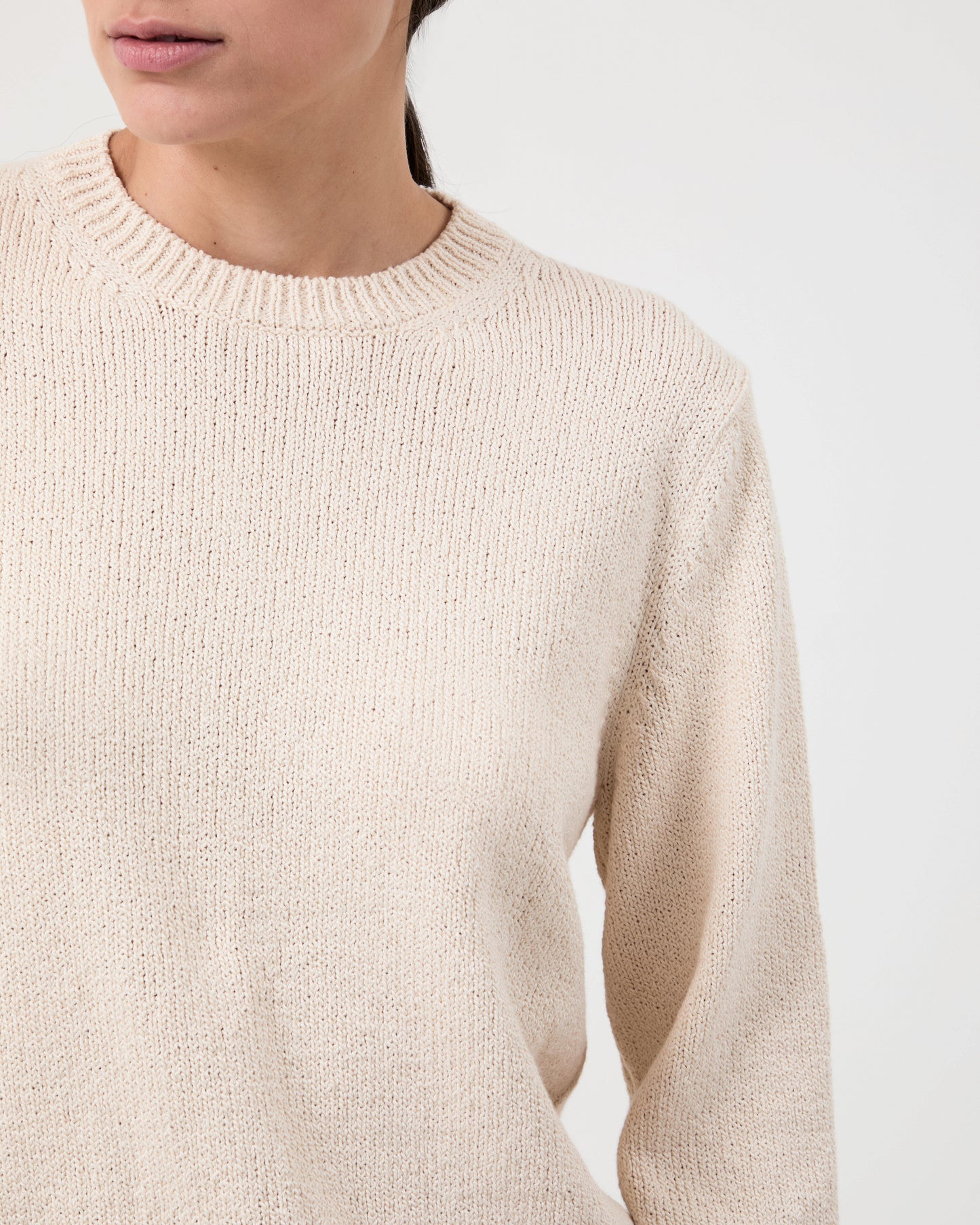 Woman wears Casasola Nina knitted cotton crewneck white - detail view