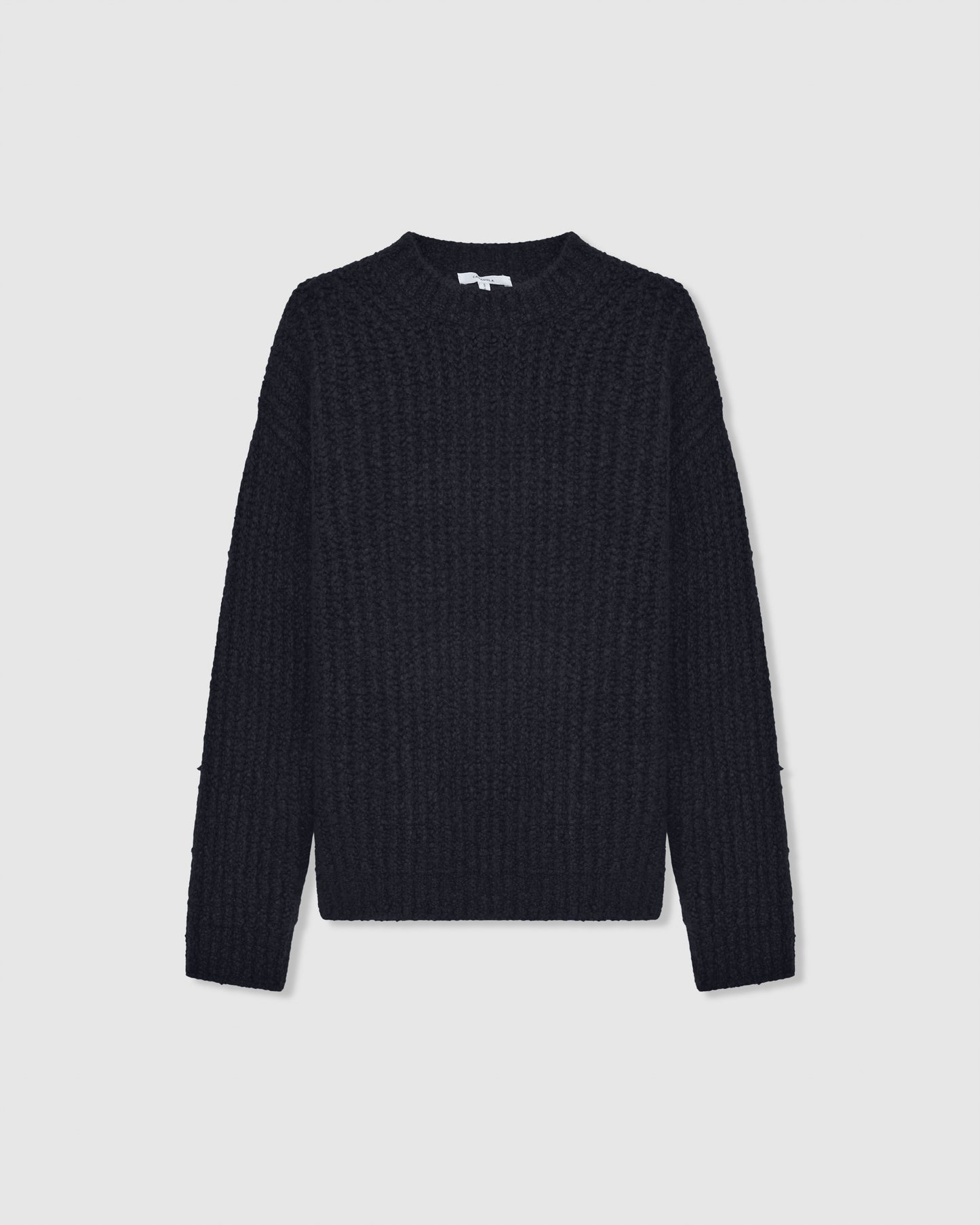 A navy-colored, oversized, four-ply knitted cashmere-silk sweater with a ribbed mock neckline, displayed on a white background.