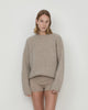 Casasola Orso beige-colored, oversized, four-ply knitted cashmere-silk sweater with a ribbed mock neckline, front view.
