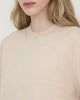 Model wearing Casasola Pia classic knitted merino wool white crewneck - detail view