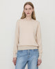 Woman wearing Casasola Pia knitted merino wool white crewneck with jeans