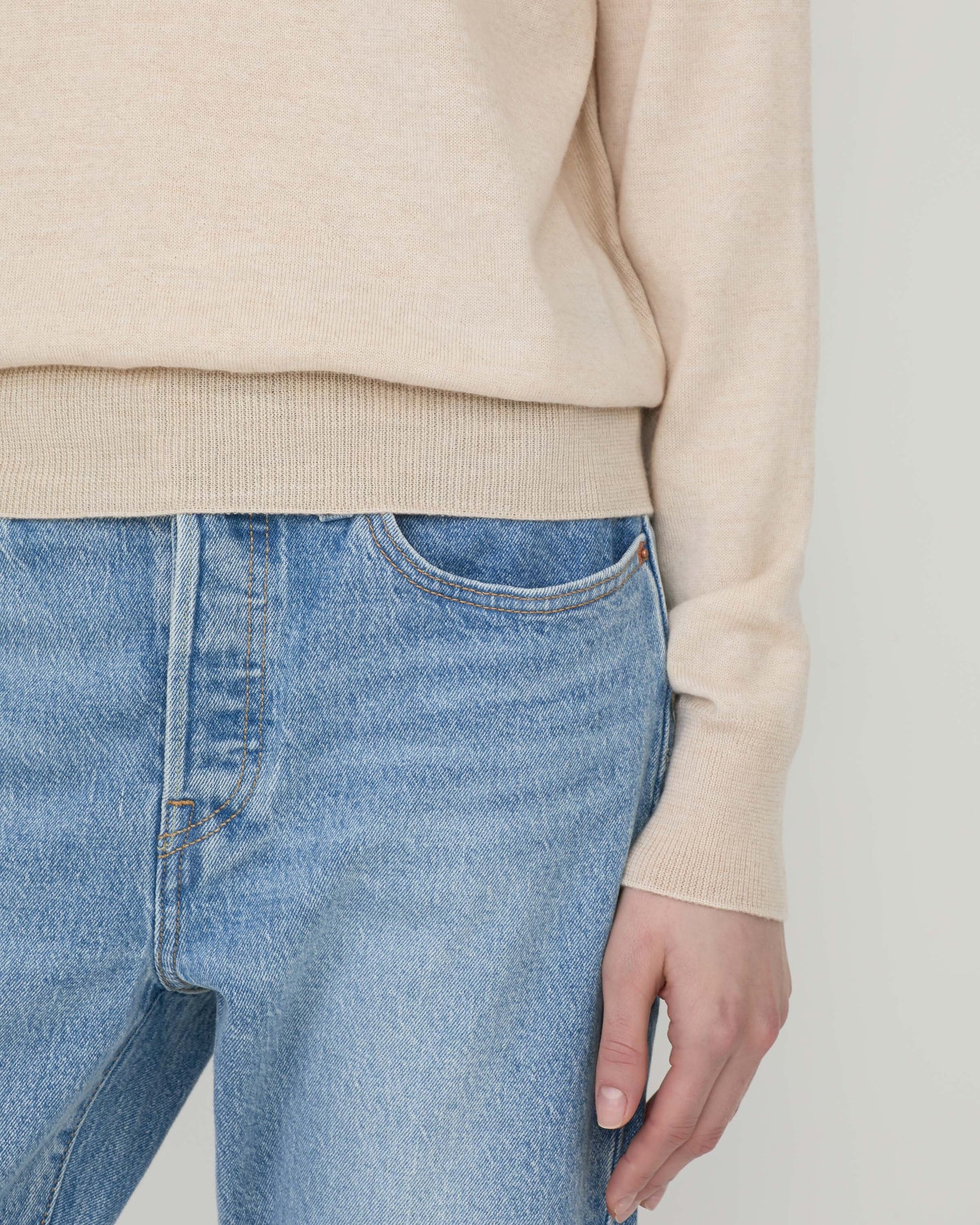 Woman wearing Casasola Pia knitted merino wool white crewneck - detail view