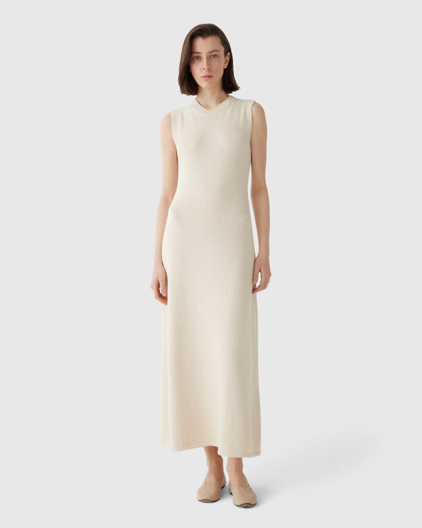 Woman wears Casasola Violeta Knitted Cotton White Midi Dress - Front View
